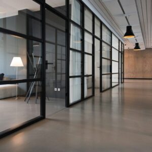 Modern office interior with glass partitions — IT Guy Reno